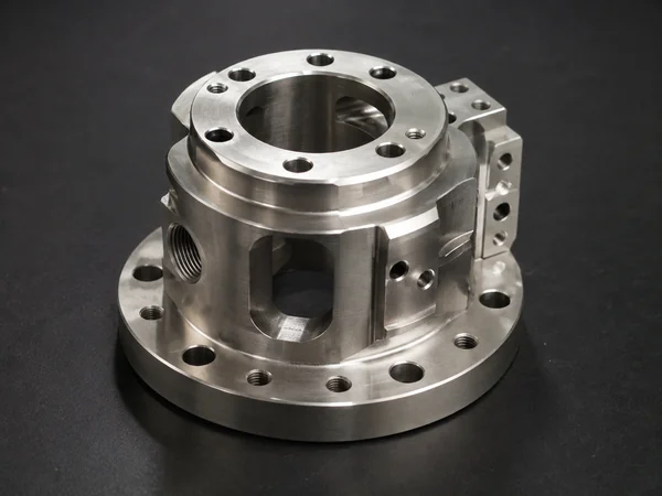 Complex cylindrical part showing turning and off-axis features